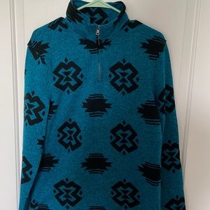 Urban Pipeline pullover half zip. Dark teal Blue with black tribal pattern.